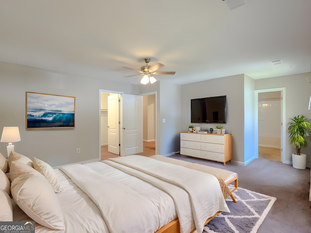 2918 Pavia Cir, Austell, GA 30106 - bedroom with a ceiling fan, baseboards, light colored carpet, and a walk in closet
