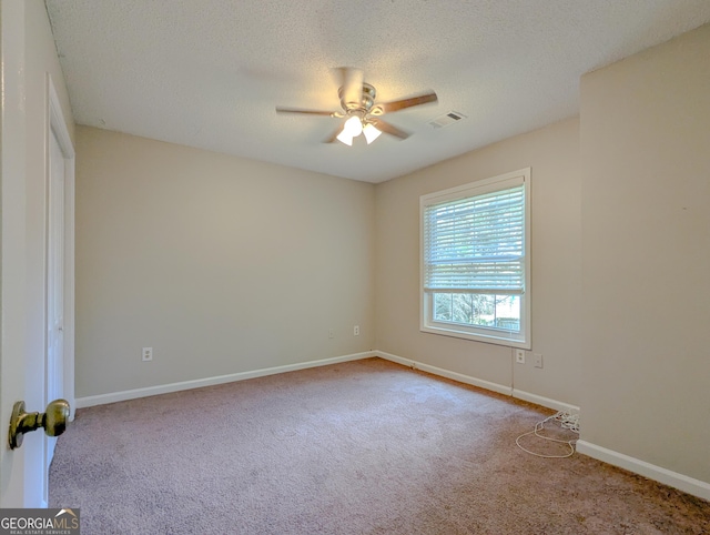 2918 Pavia Cir, Austell, GA 30106 - unfurnished room with a ceiling fan, carpet floors, baseboards, and a textured ceiling