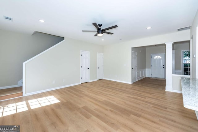 2915 Commonwealth Cir, Alpharetta, GA 30004 - unfurnished living room featuring a ceiling fan, decorative columns, light wood-style floors, recessed lighting, and baseboards