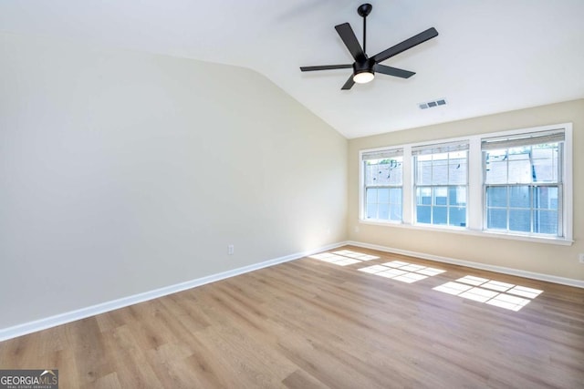 2915 Commonwealth Cir, Alpharetta, GA 30004 - unfurnished room featuring vaulted ceiling, a ceiling fan, baseboards, and wood finished floors