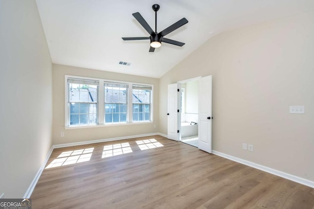 2915 Commonwealth Cir, Alpharetta, GA 30004 - empty room featuring a ceiling fan, baseboards, vaulted ceiling, and wood finished floors