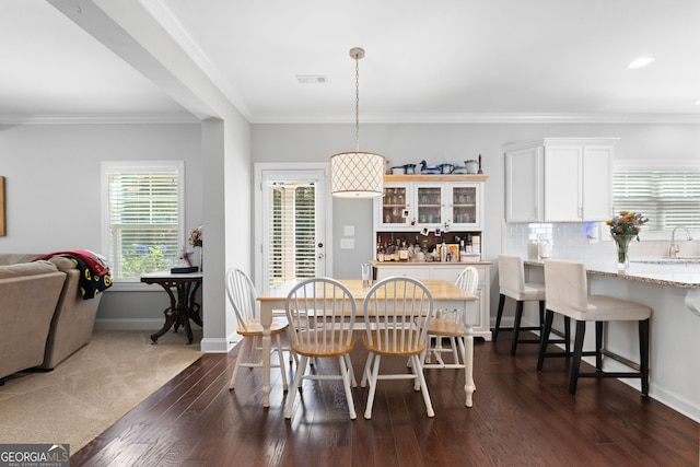 130 Edgewater Trl, Fayetteville, GA 30215 - dining space with dark wood finished floors, crown molding, and baseboards