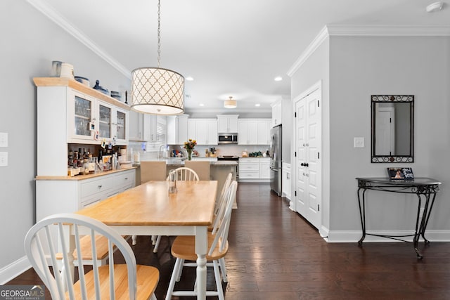 130 Edgewater Trl, Fayetteville, GA 30215 - dining space with ornamental molding, recessed lighting, baseboards, and dark wood-type flooring