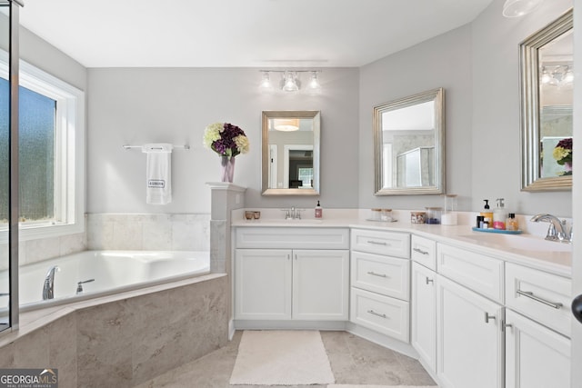 130 Edgewater Trl, Fayetteville, GA 30215 - full bath with double vanity, healthy amount of natural light, a bath, and tile patterned flooring