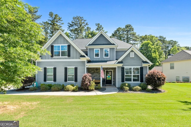 130 Edgewater Trl, Fayetteville, GA 30215 - view of front of house featuring board and batten siding and a front yard