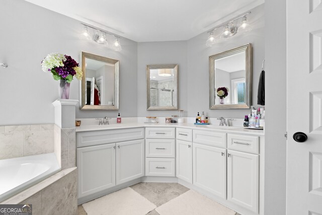 130 Edgewater Trl, Fayetteville, GA 30215 - bathroom with double vanity and a garden tub