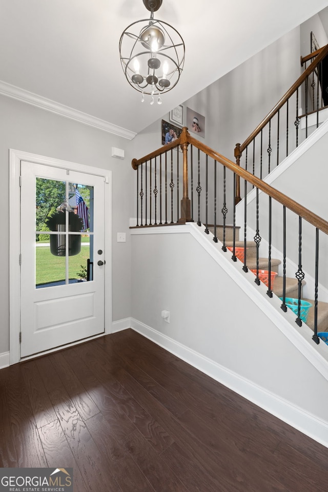 130 Edgewater Trl, Fayetteville, GA 30215 - entryway with a chandelier, wood finished floors, baseboards, stairs, and ornamental molding