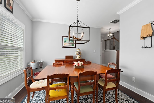 130 Edgewater Trl, Fayetteville, GA 30215 - dining room with a chandelier, dark wood finished floors, baseboards, and ornamental molding