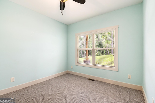 562 Yonah Lake Dr, Sautee Nacoochee, GA 30571 - carpeted spare room with baseboards and a ceiling fan