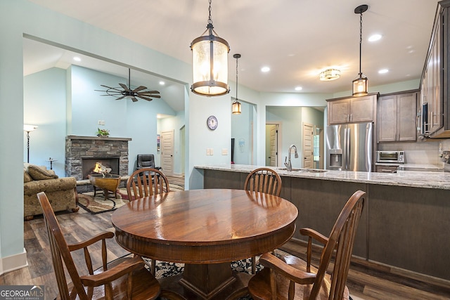 562 Yonah Lake Dr, Sautee Nacoochee, GA 30571 - dining space featuring dark wood-style floors, lofted ceiling, a stone fireplace, ceiling fan, and recessed lighting