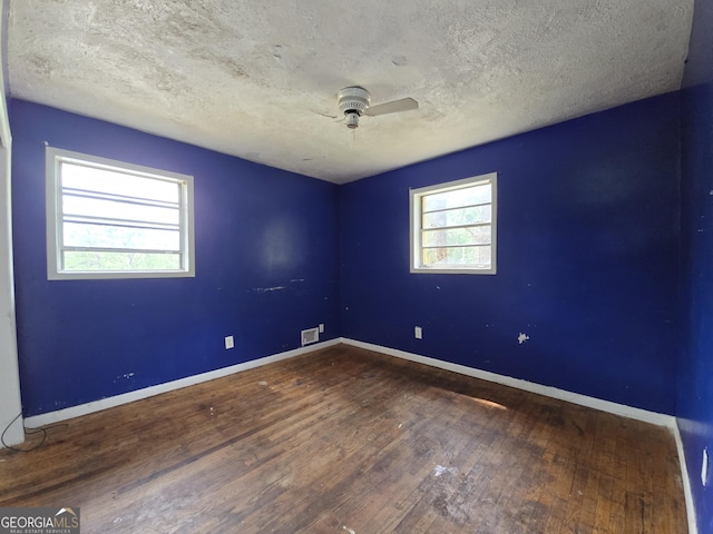 4274 Kimball Rd SW, Atlanta, GA 30331 - unfurnished room featuring hardwood / wood-style floors, a ceiling fan, baseboards, and a textured ceiling