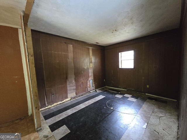 4274 Kimball Rd SW, Atlanta, GA 30331 - unfurnished room featuring tile patterned floors and wooden walls