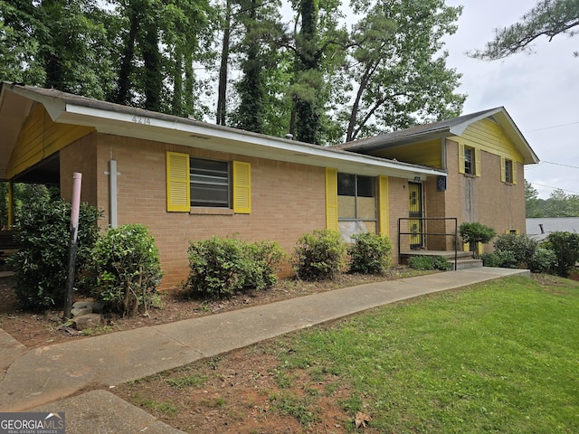4274 Kimball Rd SW, Atlanta, GA 30331 - tri-level home with brick siding and a front yard