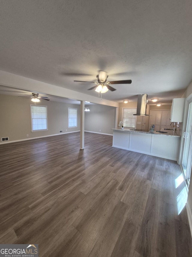 116 Cherokee Rdg, Athens, GA 30606 - unfurnished living room featuring dark wood-type flooring, ceiling fan, and a textured ceiling
