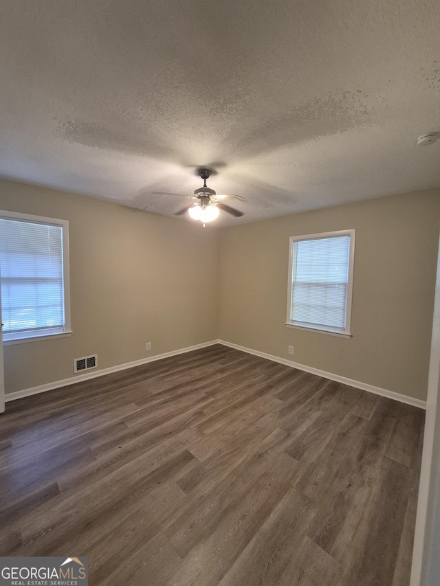 116 Cherokee Rdg, Athens, GA 30606 - unfurnished room featuring a textured ceiling, dark wood-style flooring, and ceiling fan