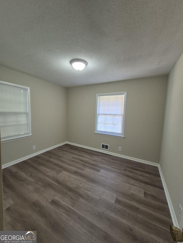 116 Cherokee Rdg, Athens, GA 30606 - unfurnished room with dark wood-type flooring and a textured ceiling