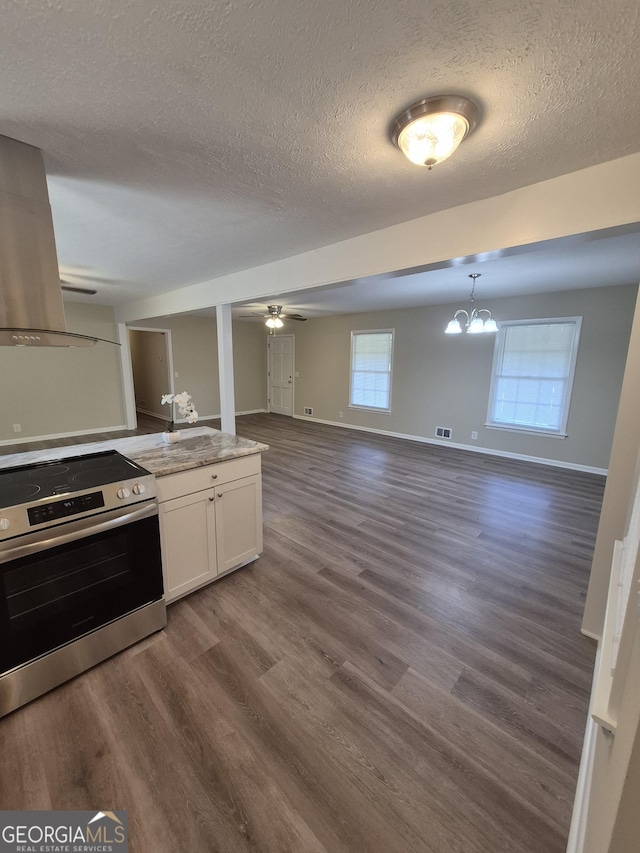 116 Cherokee Rdg, Athens, GA 30606 - kitchen with stainless steel electric range, a textured ceiling, open floor plan, white cabinets, and dark wood-style flooring