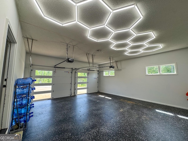 134 Roy Dean Rd, Buchanan, GA 30113 - garage featuring a garage door opener and baseboards