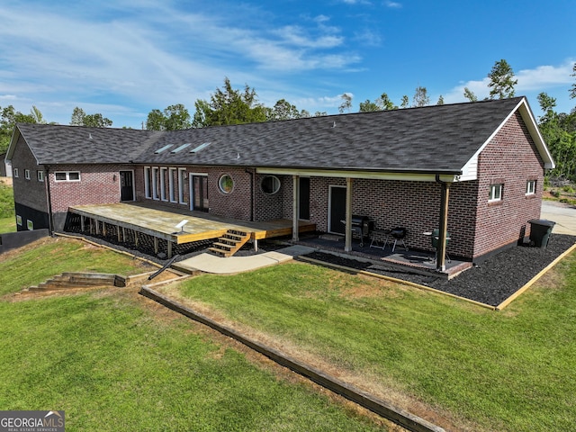 134 Roy Dean Rd, Buchanan, GA 30113 - back of property featuring a deck, brick siding, a lawn, and roof with shingles