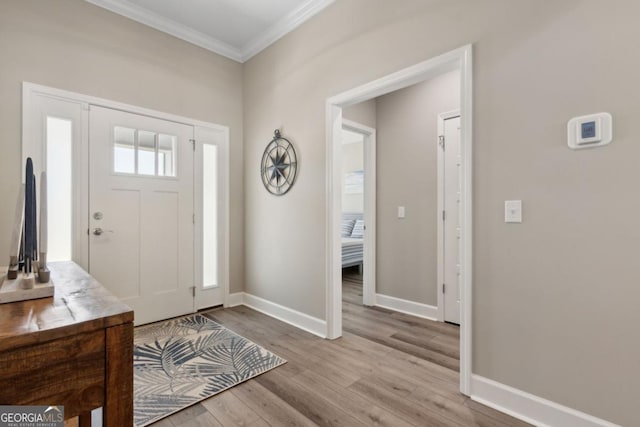 194 Pistachio Ln, Kingsland, GA 31548 - foyer entrance featuring crown molding, wood finished floors, and baseboards