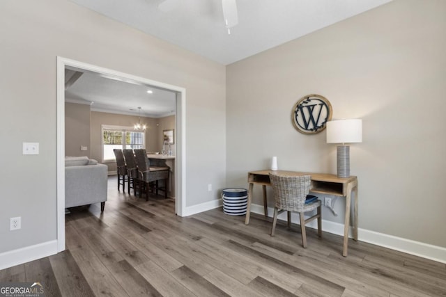 194 Pistachio Ln, Kingsland, GA 31548 - office area featuring wood finished floors, crown molding, ceiling fan, baseboards, and a chandelier