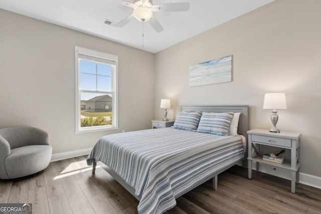 194 Pistachio Ln, Kingsland, GA 31548 - bedroom with wood finished floors, baseboards, and a ceiling fan