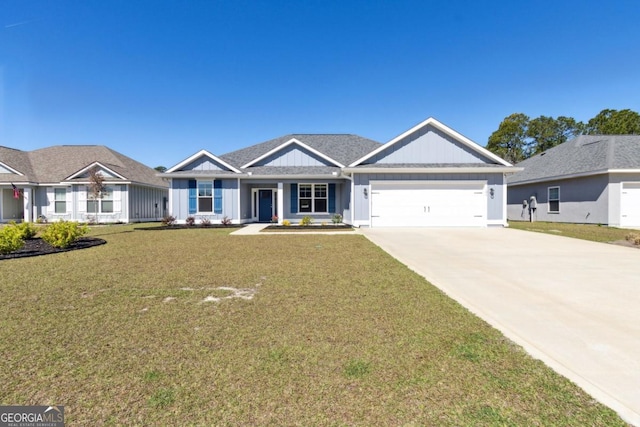 194 Pistachio Ln, Kingsland, GA 31548 - view of front facade featuring board and batten siding, an attached garage, concrete driveway, a front lawn, and covered porch