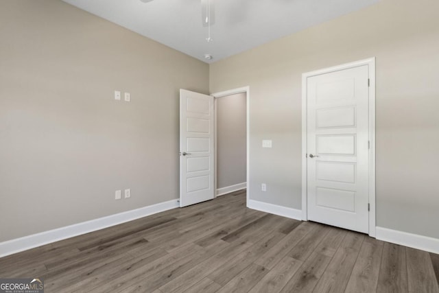 194 Pistachio Ln, Kingsland, GA 31548 - unfurnished bedroom featuring wood finished floors and baseboards