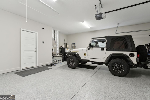 194 Pistachio Ln, Kingsland, GA 31548 - garage featuring a garage door opener and baseboards