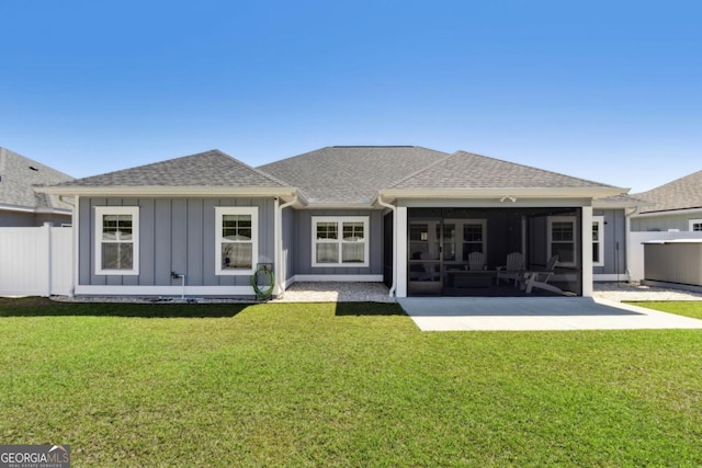 194 Pistachio Ln, Kingsland, GA 31548 - rear view of house with a shingled roof, a sunroom, and board and batten siding