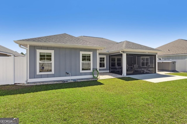 194 Pistachio Ln, Kingsland, GA 31548 - back of house featuring a sunroom, a shingled roof, and board and batten siding