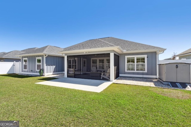 194 Pistachio Ln, Kingsland, GA 31548 - rear view of property with a sunroom, a shingled roof, a patio area, and board and batten siding