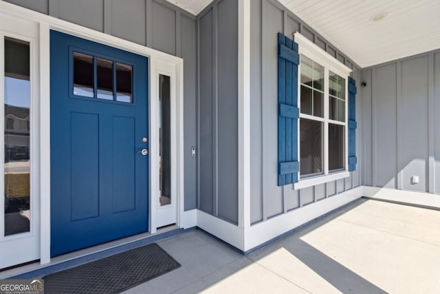 194 Pistachio Ln, Kingsland, GA 31548 - view of exterior entry with board and batten siding and covered porch