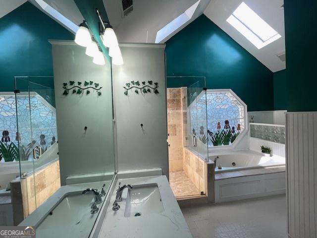 3120 Saint Andrews Cir, Duluth, GA 30096 - bathroom with a skylight, a whirlpool tub, a shower stall, vanity, and lofted ceiling