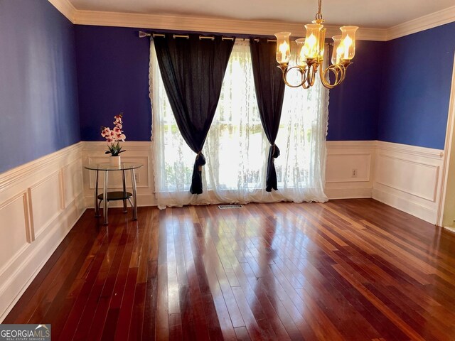 3120 Saint Andrews Cir, Duluth, GA 30096 - spare room with a chandelier, a wainscoted wall, wood-type flooring, ornamental molding, and a decorative wall