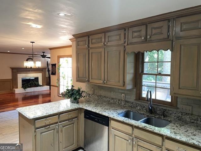 3120 Saint Andrews Cir, Duluth, GA 30096 - kitchen featuring dishwasher, a sink, a peninsula, plenty of natural light, and crown molding
