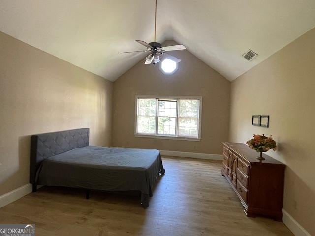 3120 Saint Andrews Cir, Duluth, GA 30096 - bedroom with vaulted ceiling, baseboards, light wood-style flooring, and a ceiling fan