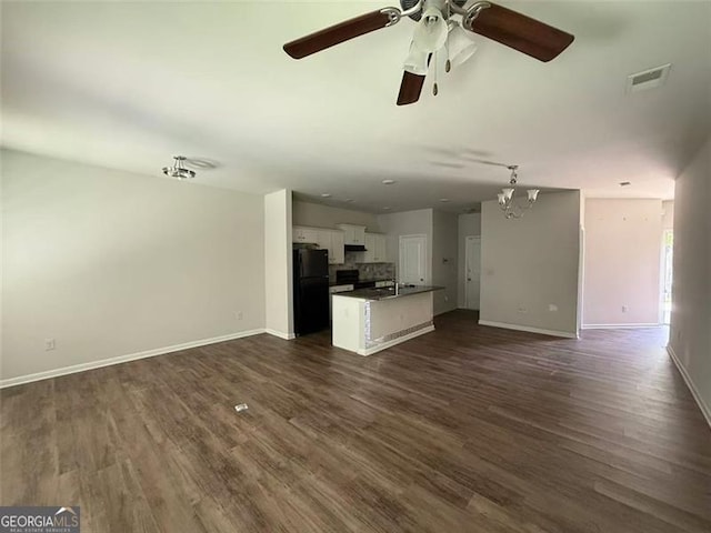 6446 Grey Fox Way, Riverdale, GA 30296 - unfurnished living room featuring ceiling fan, baseboards, and dark wood-style floors