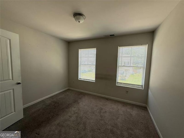 6446 Grey Fox Way, Riverdale, GA 30296 - carpeted spare room with baseboards