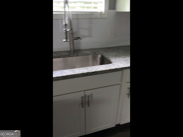 836 Wood St NW, Atlanta, GA 30318 - kitchen view of light stone countertops and white cabinetry