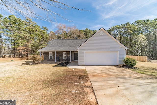 704 Stonecrest Ln, Loganville, GA 30052 - view of front of house with driveway and an attached garage
