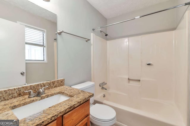 744 Martin Rd, Stone Mountain, GA 30088 - full bath featuring a textured ceiling, vanity, and shower / bath combination