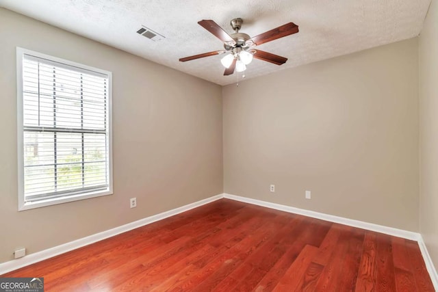 744 Martin Rd, Stone Mountain, GA 30088 - unfurnished room with ceiling fan, wood finished floors, and a textured ceiling
