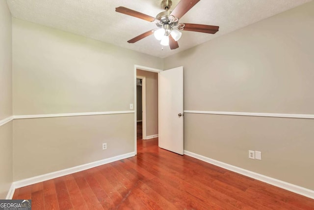 744 Martin Rd, Stone Mountain, GA 30088 - unfurnished room with wood finished floors and a ceiling fan