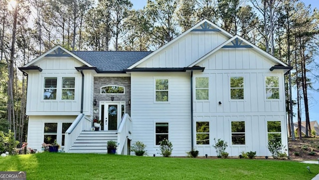 6565 Nix Rd, Dawsonville, GA 30534 - view of front of home featuring board and batten siding, a front lawn, and a shingled roof