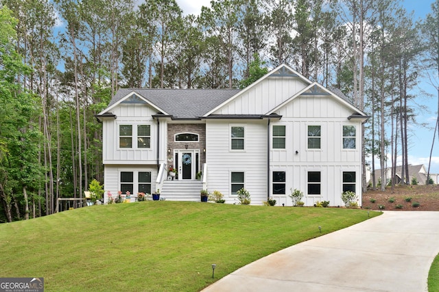 6565 Nix Rd, Dawsonville, GA 30534 - view of front of property with board and batten siding, a front lawn, and roof with shingles