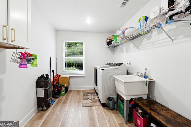 6565 Nix Rd, Dawsonville, GA 30534 - laundry area featuring washer and clothes dryer, baseboards, cabinet space, light wood finished floors, and recessed lighting