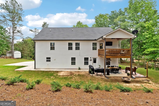 6565 Nix Rd, Dawsonville, GA 30534 - rear view of property featuring a fire pit, a ceiling fan, a patio area, a yard, and a shingled roof