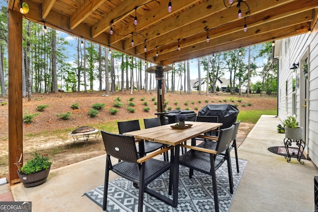 6565 Nix Rd, Dawsonville, GA 30534 - view of patio with outdoor dining space and a fire pit