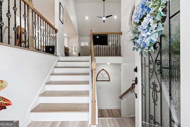 6565 Nix Rd, Dawsonville, GA 30534 - stairs with a high ceiling, wood finished floors, and baseboards
